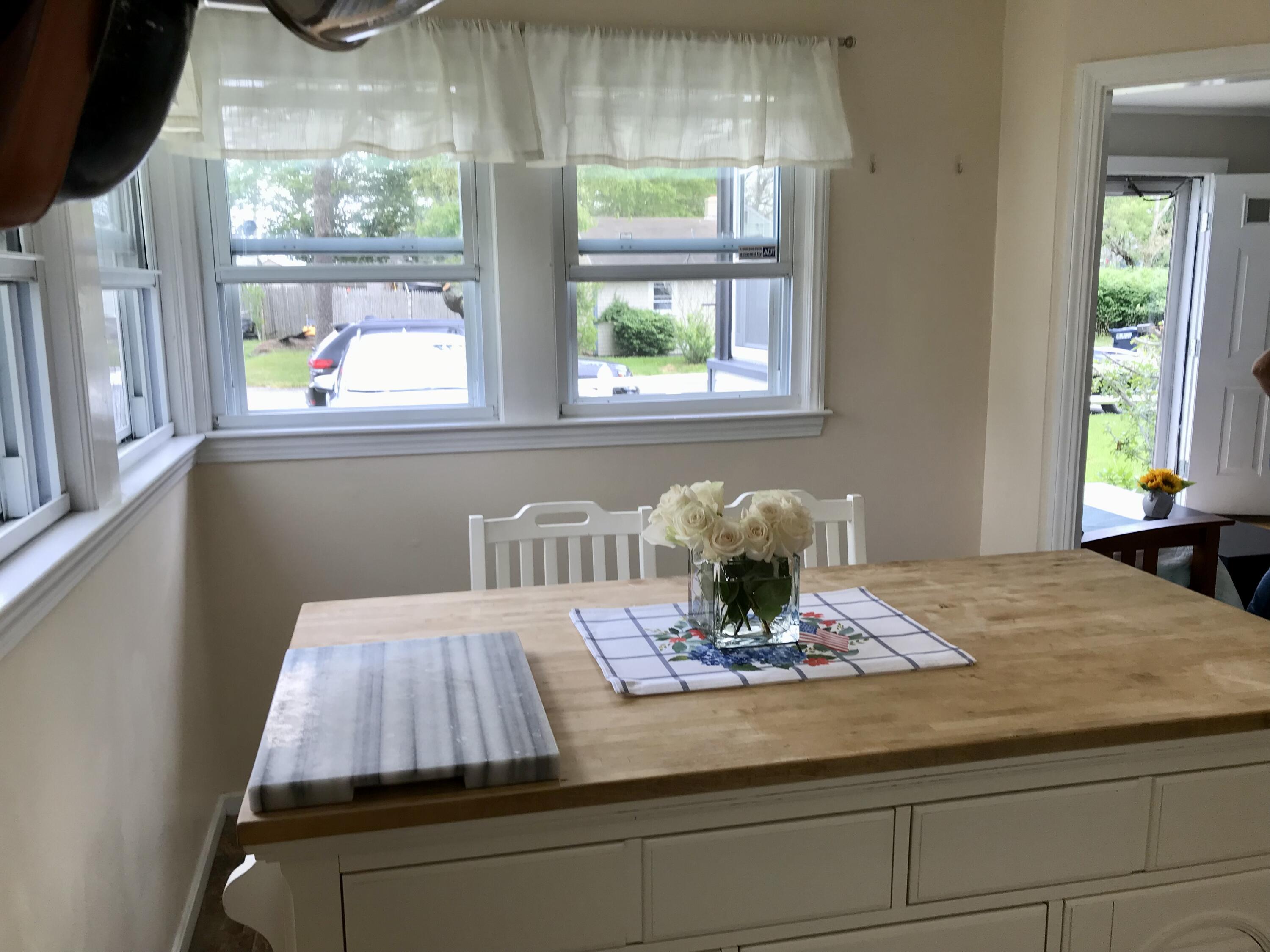 149 Hinckley Road Hyannis, MA 02601 - Photo 8 of 27 a kitchen view with a table and chairs in it