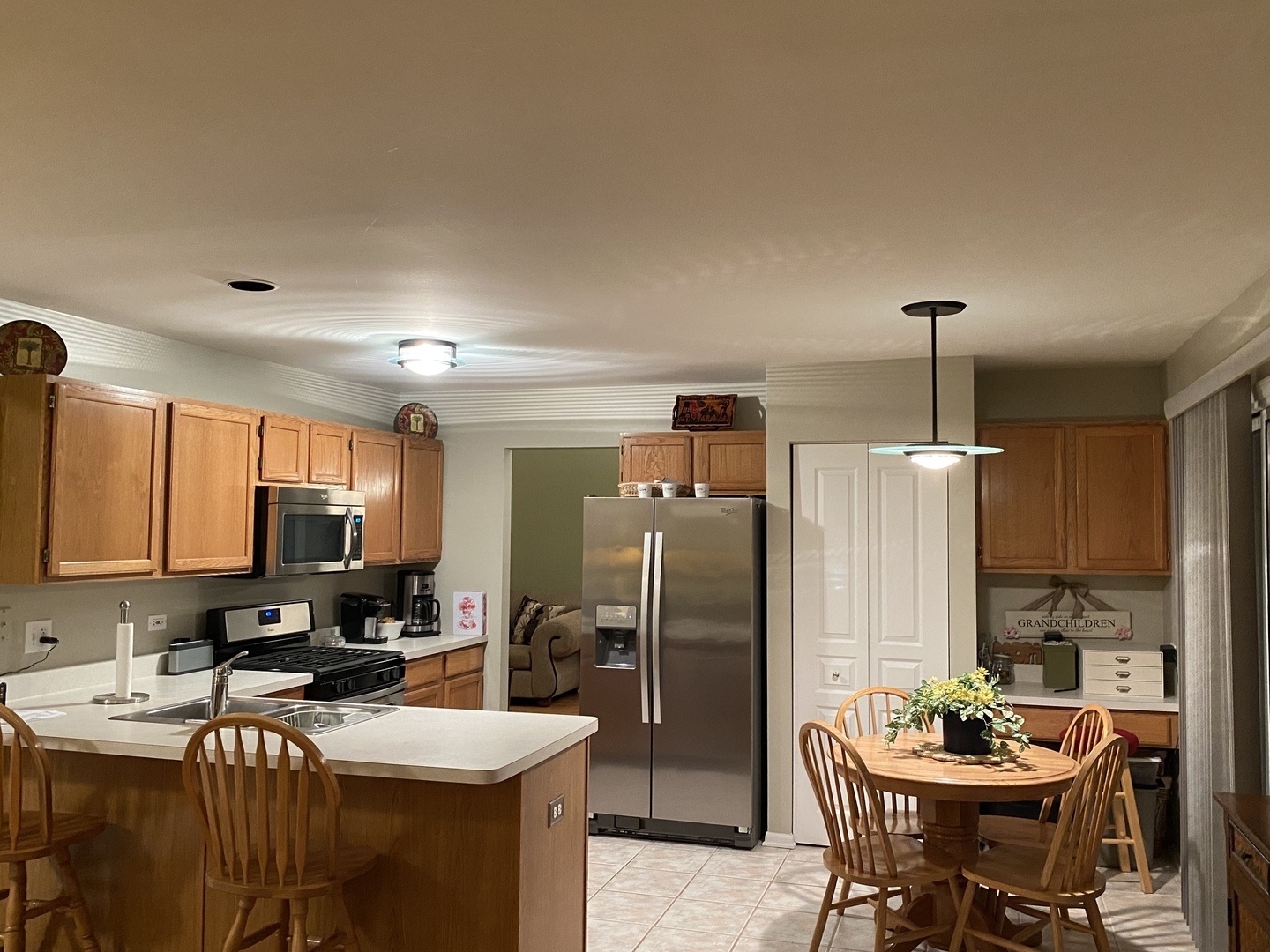 418 Cardinal Drive Bartlett, IL 60103 - Photo 7 of 29 a kitchen with a refrigerator and a stove top oven