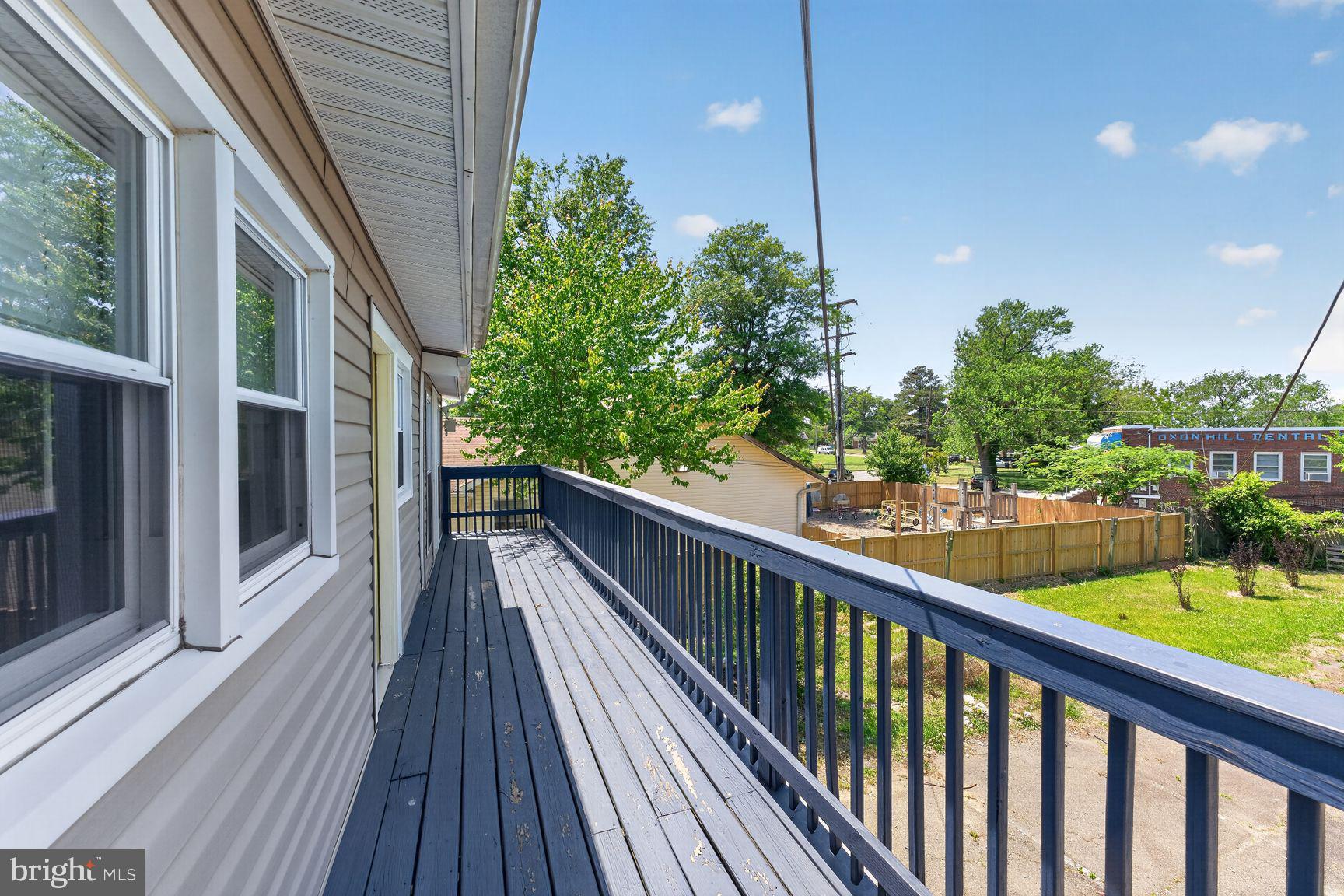 7205 Livingston Road Oxon Hill, MD 20745 - Photo 3 of 25 Sunny balcony with lush greenery views.