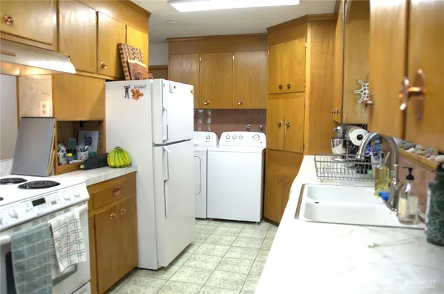 a kitchen with a sink and a window