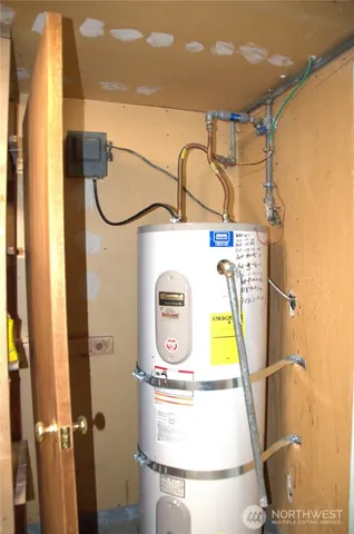 a kitchen with a refrigerator and a stove