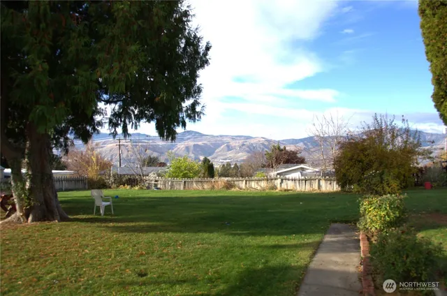 a view of a golf course with a lake view