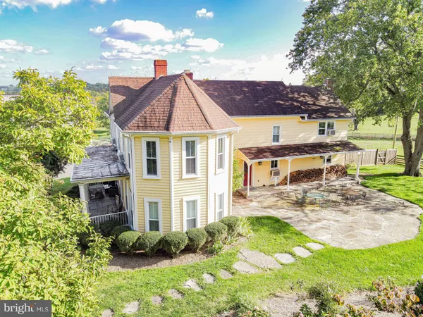 a balcony with furniture and a potted plant
