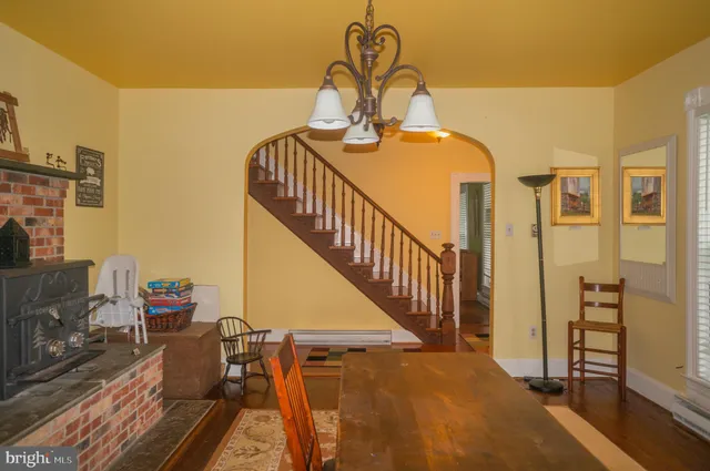 a view of a balcony with chair and wooden floor