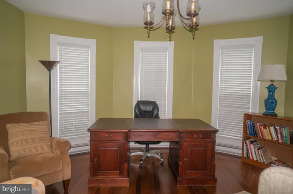 a view of a patio with table and chairs and potted plants