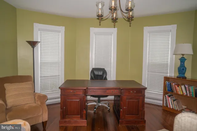 a view of a patio with table and chairs and potted plants