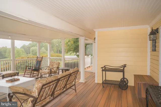 a backyard of a house with lots of green space and lake view