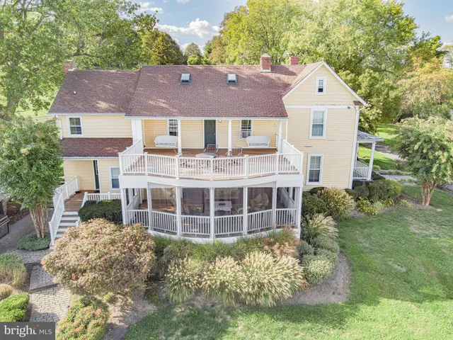 a view of a swimming pool with a yard