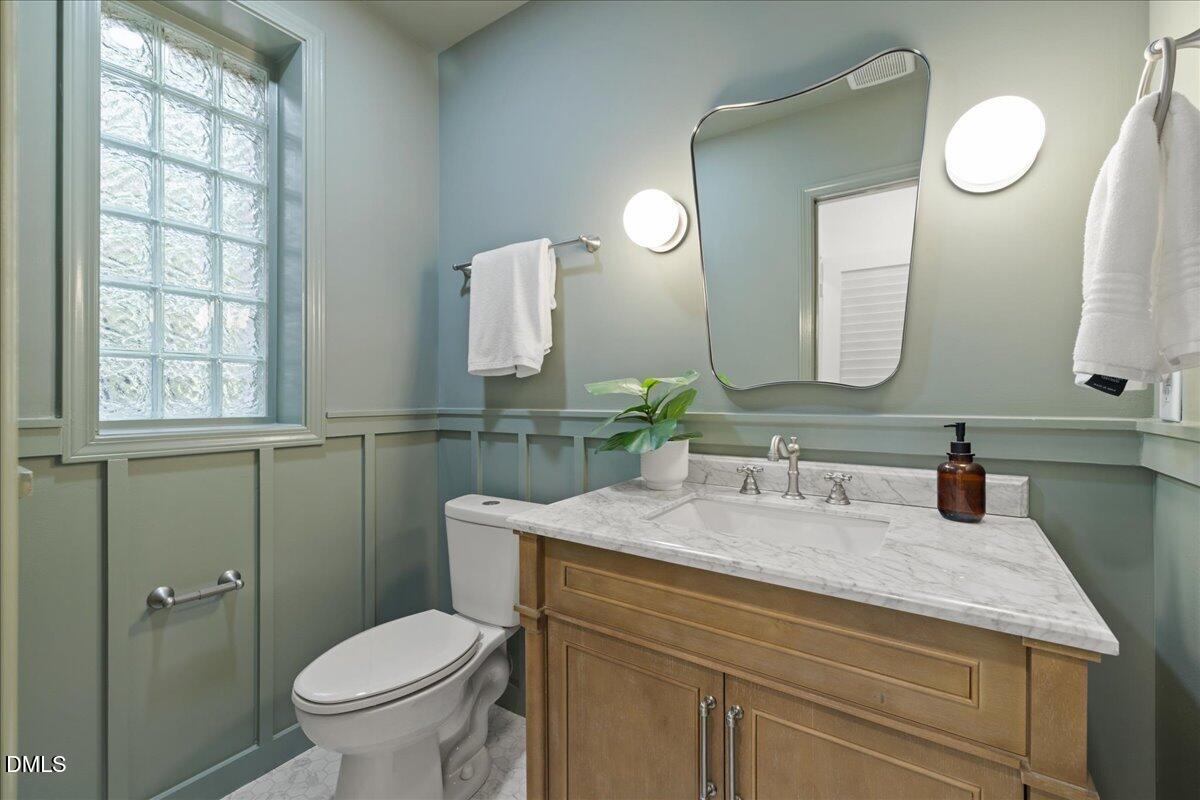 1615 Carbonton Road Sanford, NC 27330 - Photo 18 of 49 a bathroom with a granite countertop toilet sink and mirror