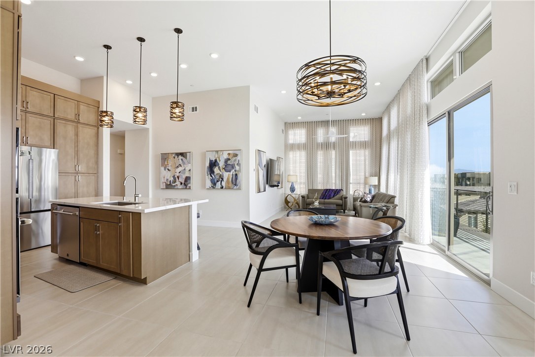 4159 Solace Street, Unit 2 Las Vegas, NV 89135 - Photo 11 of 71 Lovely dining area and kitchen. Upgraded lighting and 3 panel slider to large balcony.