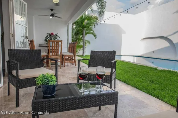 a view of outdoor dining space with a patio and plants