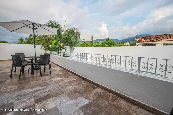 swimming pool view with a seating space