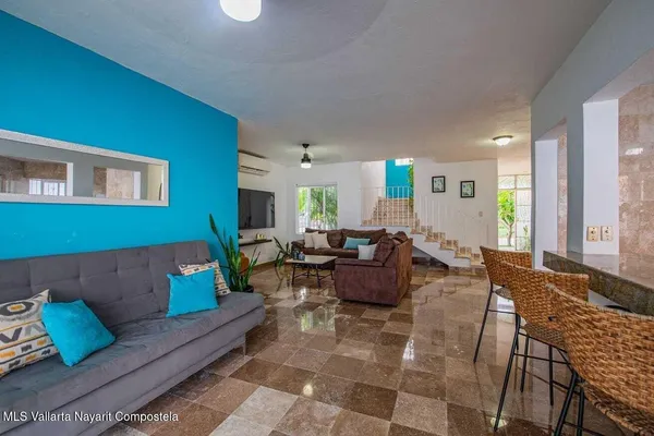 a living room with furniture and a window