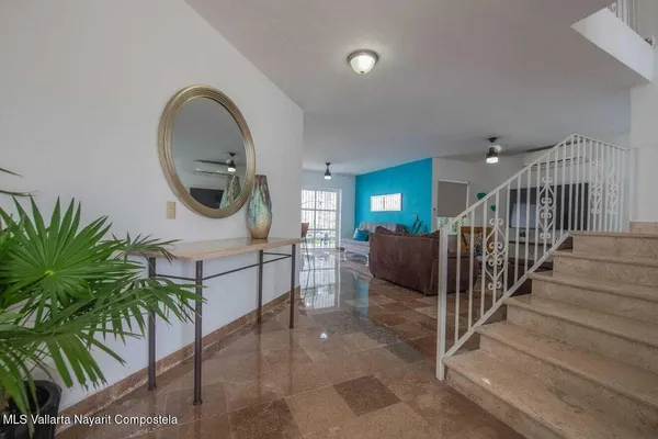 a view of entryway livingroom and hall with wooden floor