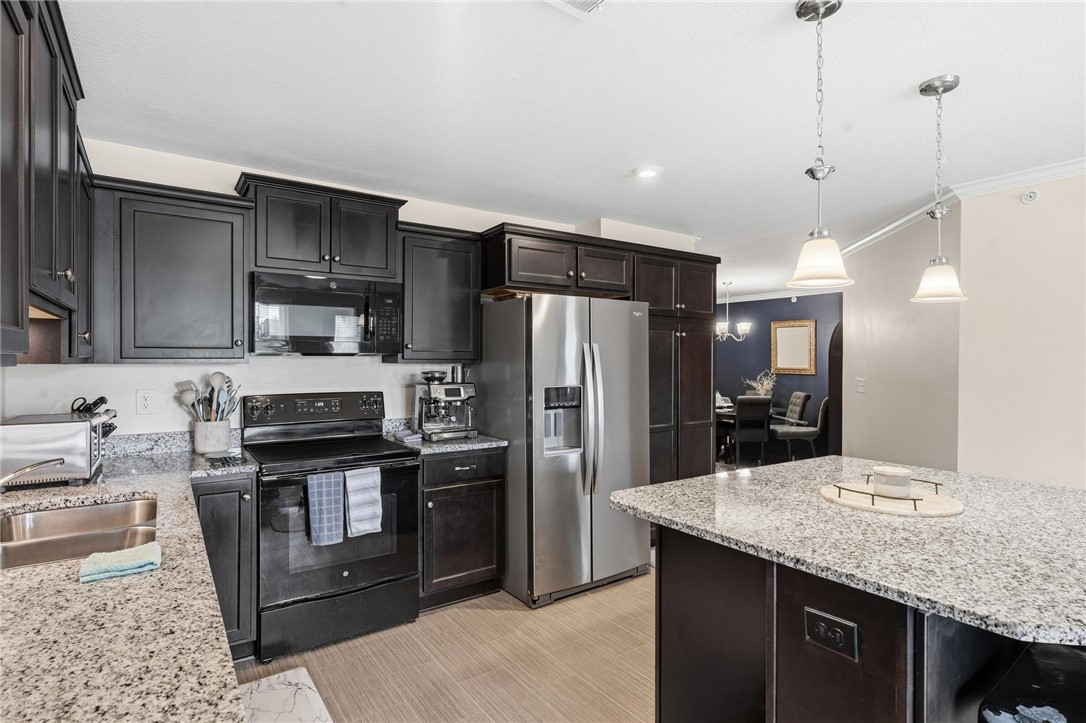 141 Old Pond Road Springboro, OH 45066 - Photo 9 of 20 This kitchen features sleek cabinetry and premium appliances, perfect for culinary endeavors.