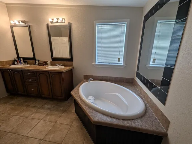 a bathroom with a bathtub and a sink