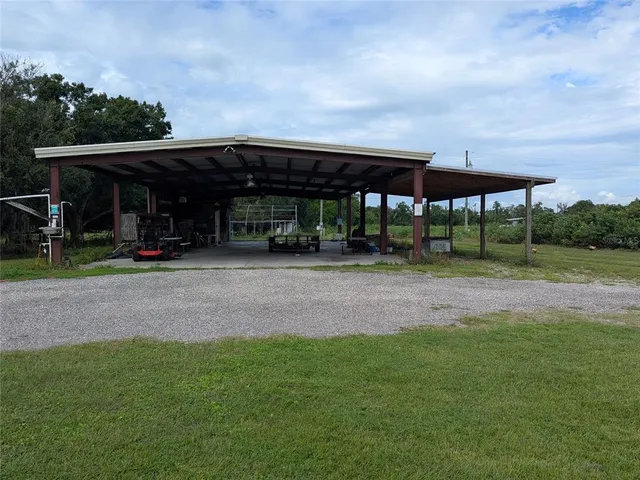a view of outdoor space with deck and yard