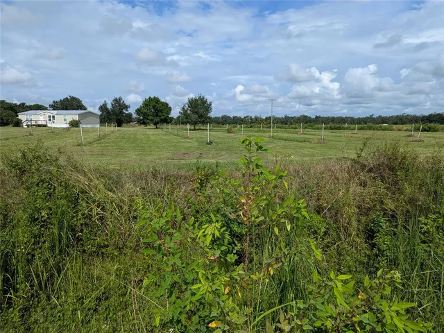 a view of a lake with a big yard