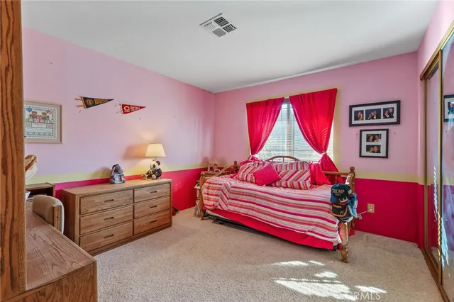 a bed room with a bed and a couch