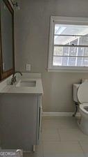 1080 Laboon Road Monroe, GA 30655 - Photo 13 of 19 a bathroom with a sink and a toilet