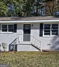 front view of a house with a small yard
