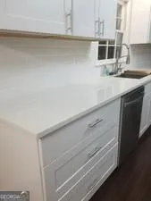 a kitchen with stainless steel appliances wooden cabinets and a microwave