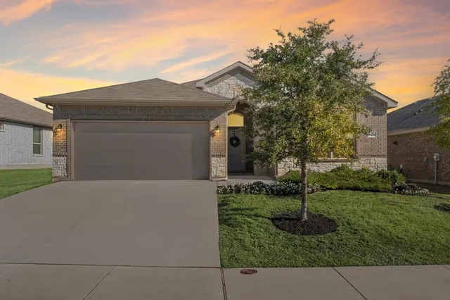 a front view of house with garden
