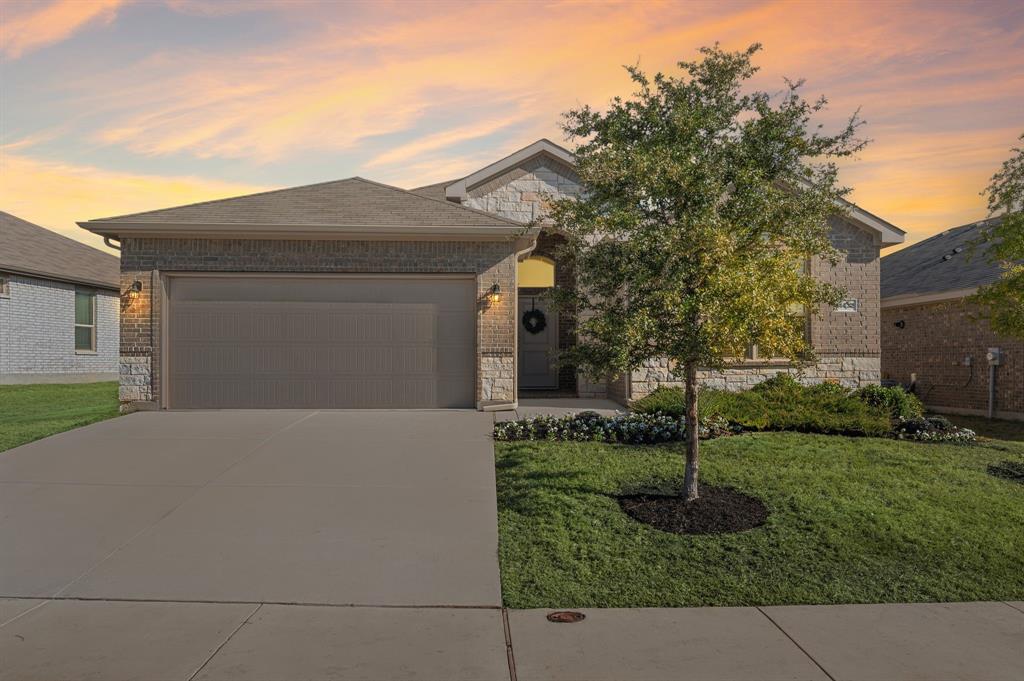 a front view of house with garden