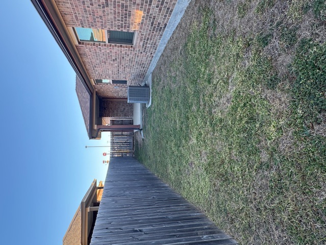 101 Calvin Smith Ln., Unit B Jarrell, TX 76537 - Photo 29 of 33 Fenced backyard featuring a patio