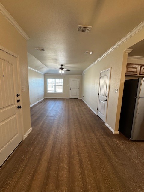 101 Calvin Smith Ln., Unit B Jarrell, TX 76537 - Photo 4 of 33 Spacious Living room with ornamental molding, wood-like finished floors, ceiling fan, and lofted ceiling