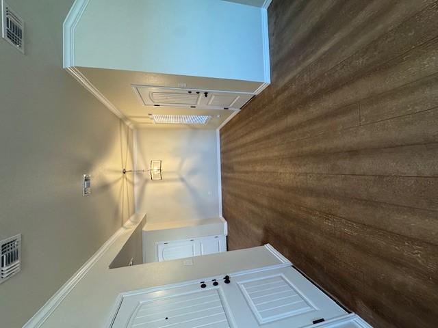 101 Calvin Smith Ln., Unit B Jarrell, TX 76537 - Photo 5 of 33 Dining area with wood-like flooring, ornamental molding, and a chandelier