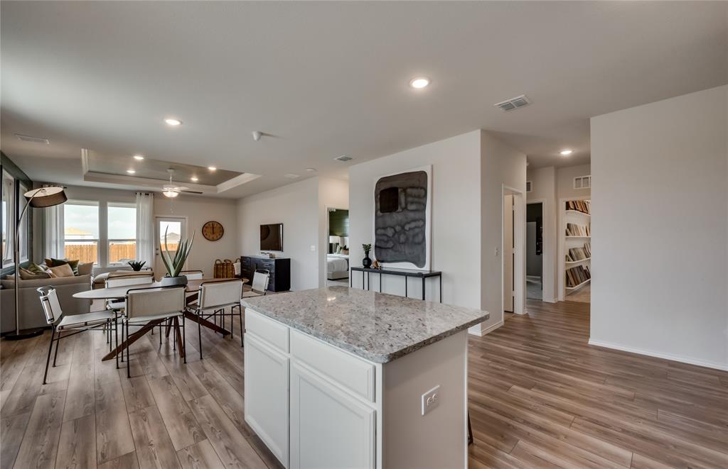 14053 Ladbroke Street Pilot Point, TX 76258 - Photo 7 of 19 Large island overlooking gathering room and dining areas