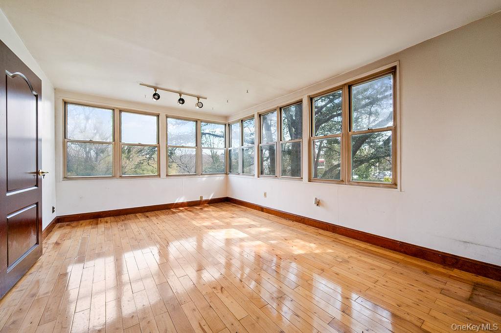 11 Valley View Road Great Neck, NY 11021 - Photo 4 of 19 a view of an empty room with a window