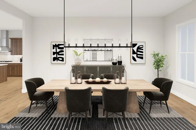 a dining room with furniture a rug and wooden floor