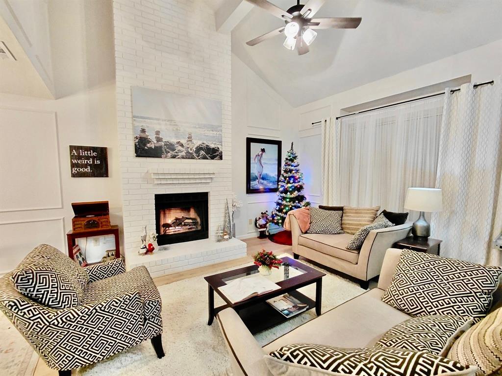 3411 Beech Street Rowlett, TX 75089 - Photo 1 of 32 a living room with furniture and a fireplace