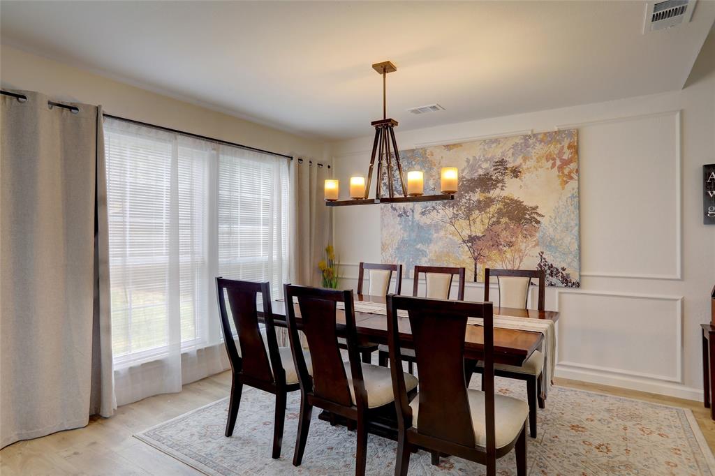 3411 Beech Street Rowlett, TX 75089 - Photo 11 of 32 a view of a dining room with furniture window and wooden floor