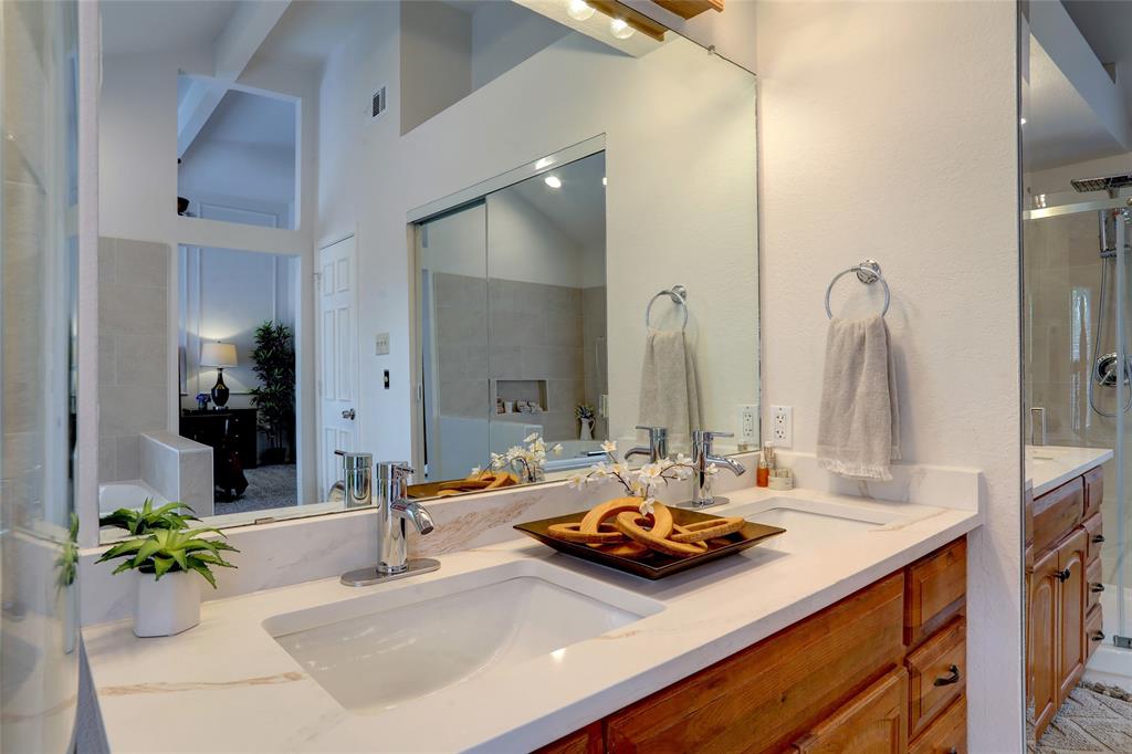 3411 Beech Street Rowlett, TX 75089 - Photo 17 of 32 a bathroom with a double vanity sink and a mirror