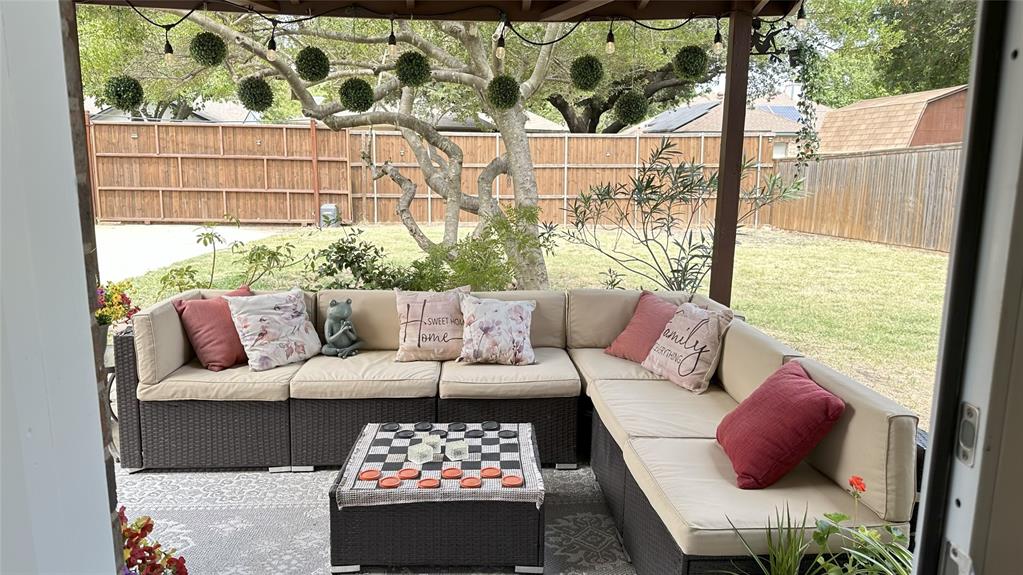 3411 Beech Street Rowlett, TX 75089 - Photo 28 of 32 a living room with furniture and a floor to ceiling window