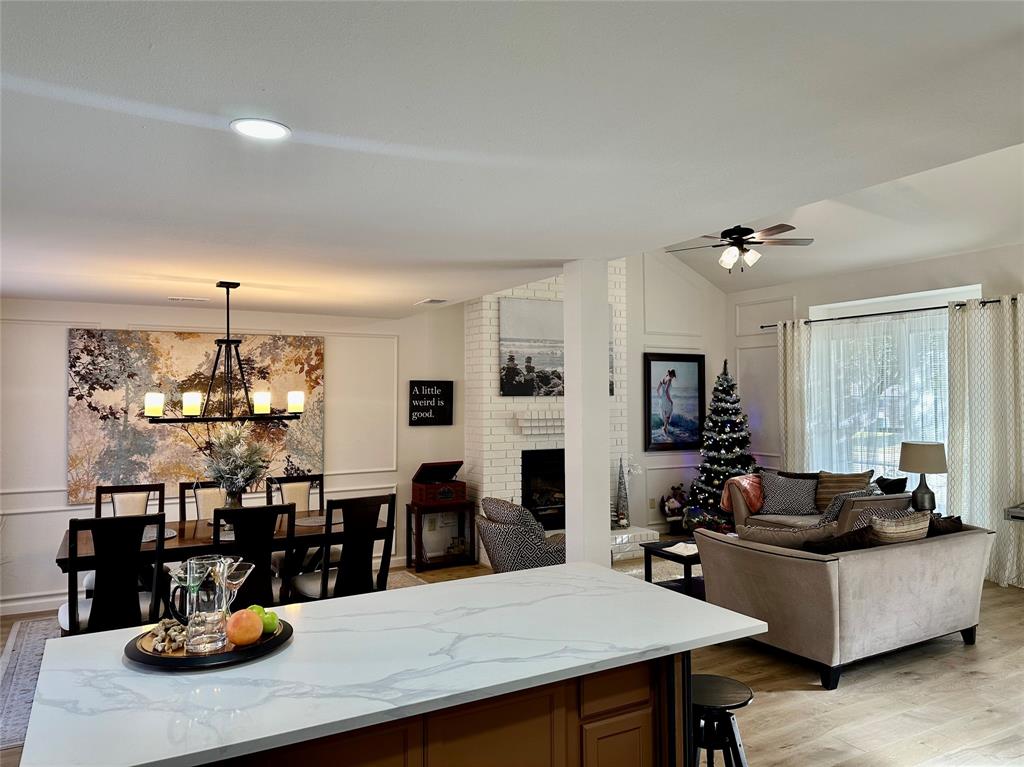 3411 Beech Street Rowlett, TX 75089 - Photo 3 of 32 a living room with lots of furniture and view of kitchen