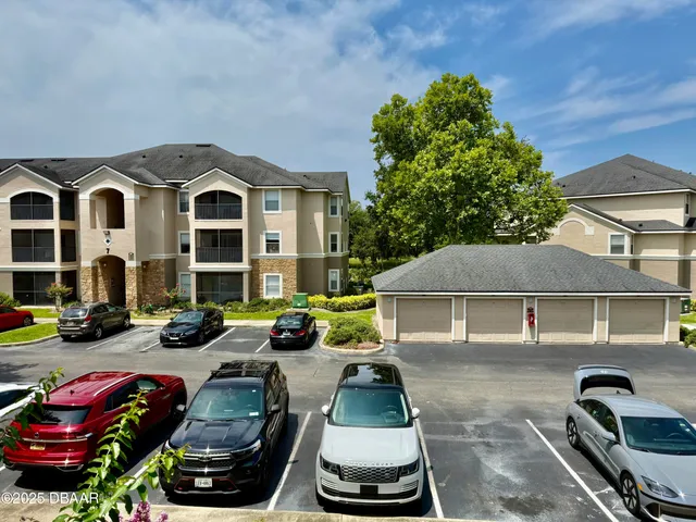 a front view of a house with many windows