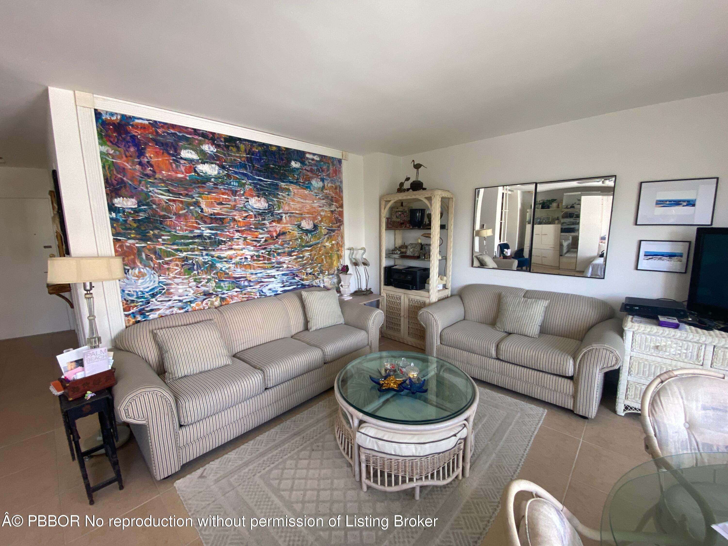 44 Cocoanut Row, Unit 509B Palm Beach, FL 33480 - Photo 4 of 7 a living room with furniture and a large window