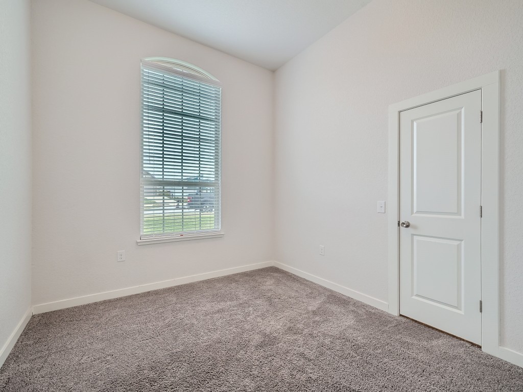 11400 American Mustang Loop Manor, TX 78653 - Photo 16 of 24 an empty room with a window