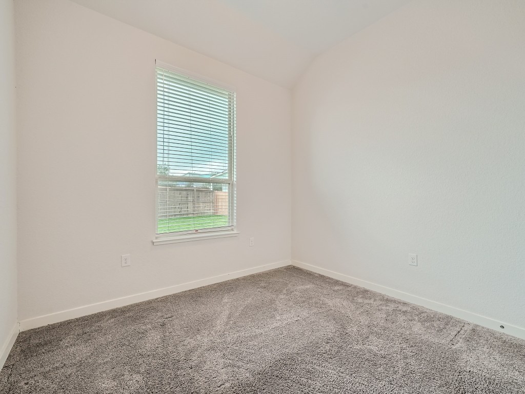 11400 American Mustang Loop Manor, TX 78653 - Photo 18 of 24 an empty room with a window