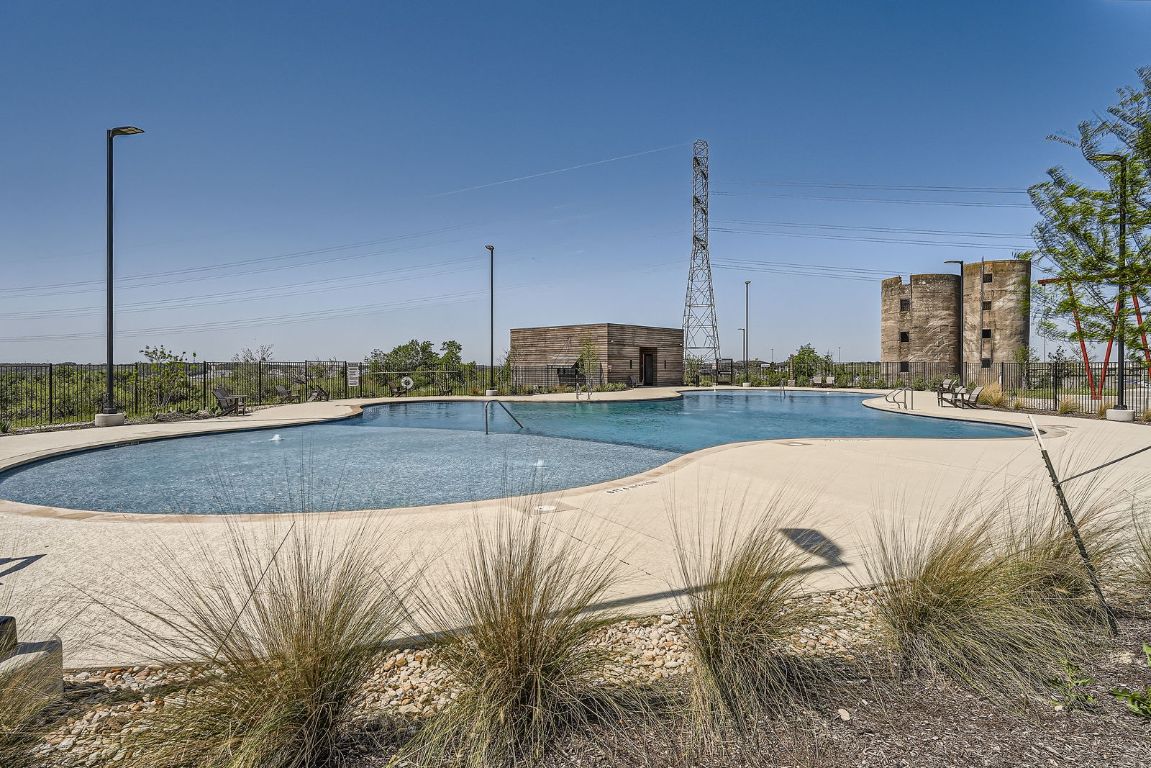 11400 American Mustang Loop Manor, TX 78653 - Photo 23 of 24 a view of a swimming pool with a yard