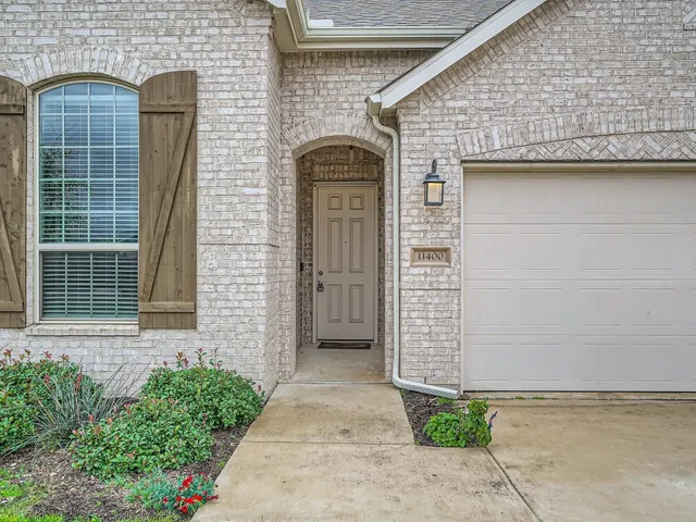 a front view of a house with garage