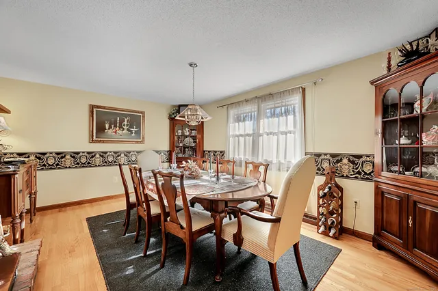 a view of a dining room with furniture and a window
