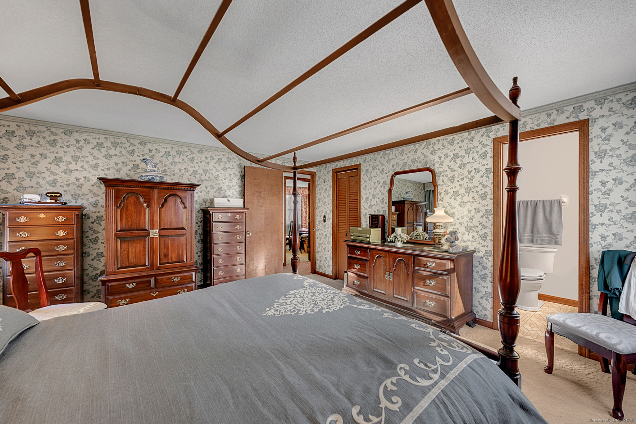 52 Wood Creek Road Burlington, CT 06013 - Photo 19 of 40 a bedroom with a bed and a dresser next to a window