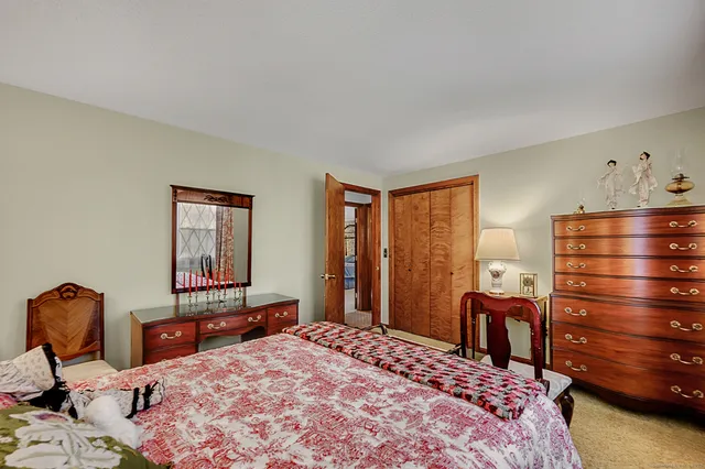 a bedroom with a bed and a cabinets