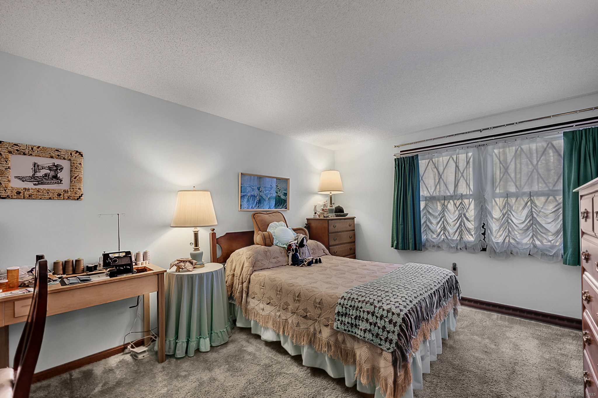 52 Wood Creek Road Burlington, CT 06013 - Photo 23 of 40 a bedroom with a bed and a large window