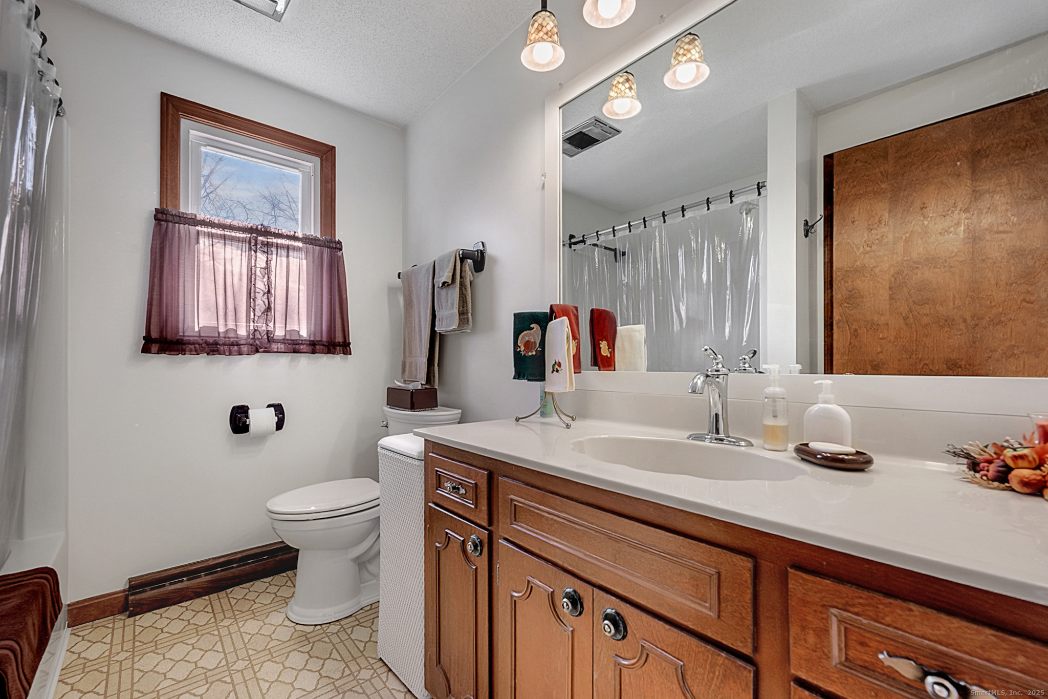 52 Wood Creek Road Burlington, CT 06013 - Photo 25 of 40 a bathroom with a granite countertop sink mirror vanity and toilet